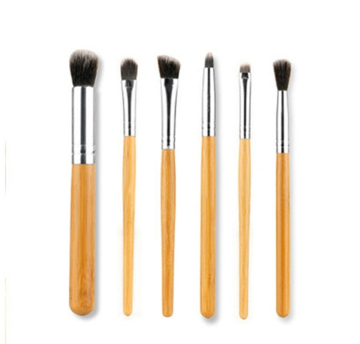 11 bamboo handles, makeup brush, tool set, linen bag, blush brush, foundation brush, and a full set of makeup.