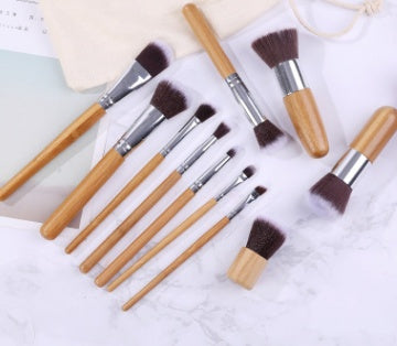 11 bamboo handles, makeup brush, tool set, linen bag, blush brush, foundation brush, and a full set of makeup.